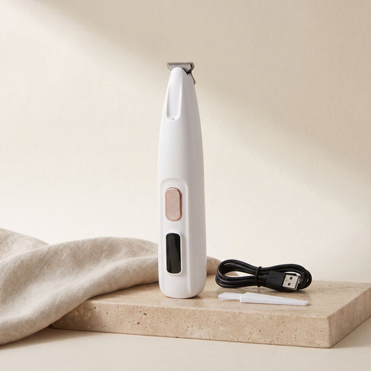 White cordless paw trimmer with LED light, cleaning brush and USB cable