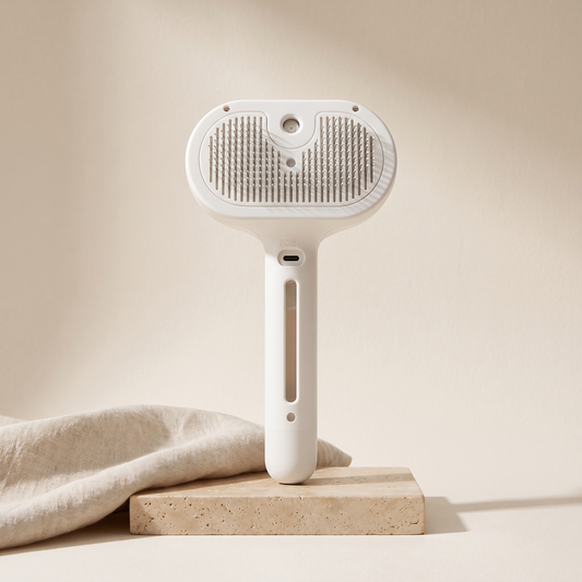 White spray grooming brush for dogs and cats